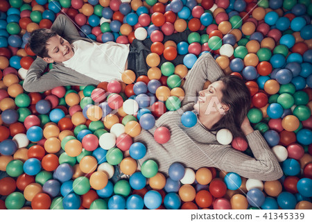 Top view. Happy mom and son in pool with balls Top view. Happy mom and son in pool with balls 41345339