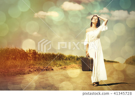 young woman with suitcase young woman with suitcase 41345728
