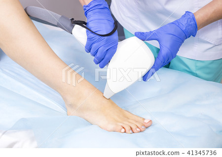 The process of laser depilation of female limbs in The process of laser depilation of female limbs in 41345736
