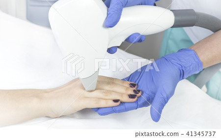 The process of laser depilation of female limbs in The process of laser depilation of female limbs in 41345737