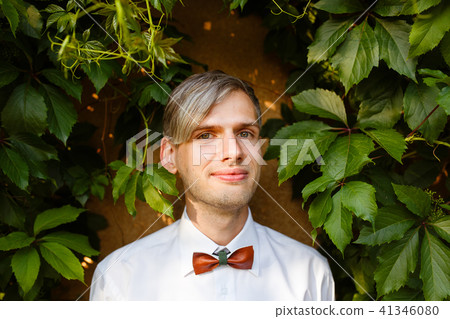 Portrait of the groom with a bow tie. Portrait of the groom with a bow tie. 41346080