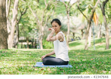 asian woman yoga outdoors while practice yoga. asian woman yoga outdoors while practice yoga. 41347648
