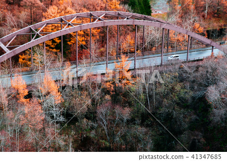 Hokkaido highway red truss bridge autumn foliage 41347685