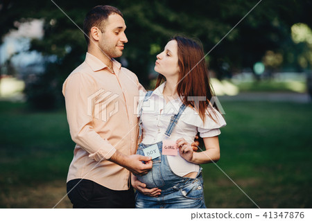 Happy couple guessing baby gender. Happy couple guessing baby gender. 41347876