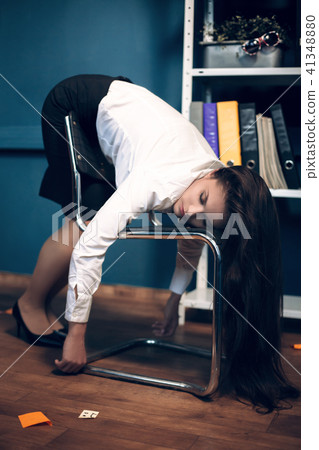 Lady sleeping on chair in weird pose. Lady sleeping on chair in weird pose. 41348880