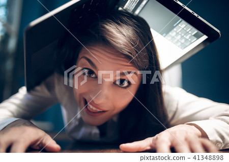 Business woman lying on table. Business woman lying on table. 41348898