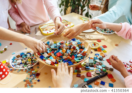 mosaic puzzle art for kids, children's creative game. two sisters are playing mosaic 41350364