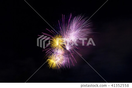 Fireworks light up close-up against dark sky Fireworks light up close-up against dark sky 41352558