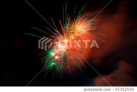 Fireworks light up close-up against dark sky Fireworks light up close-up against dark sky 41352559