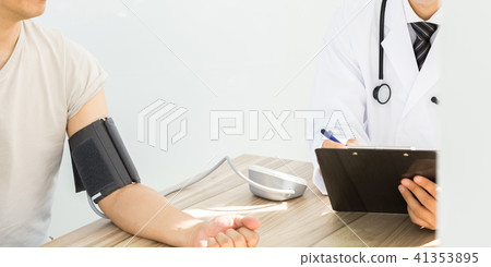 Doctor measuring blood pressure 41353895