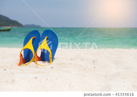 Beach sandals on the sandy sea coast, summer concept holiday and Beach sandals on the sandy sea coast, summer concept holiday and 41355618