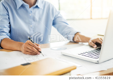 Person's engineer Hand Drawing Plan On Blue Print with architect Person's engineer Hand Drawing Plan On Blue Print with architect 41355619