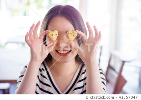 Heart shaped cookie and female Heart shaped cookie and female 41357047