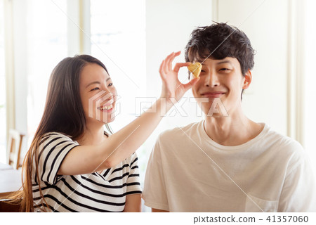 Heart shaped cookie and couple Heart shaped cookie and couple 41357060