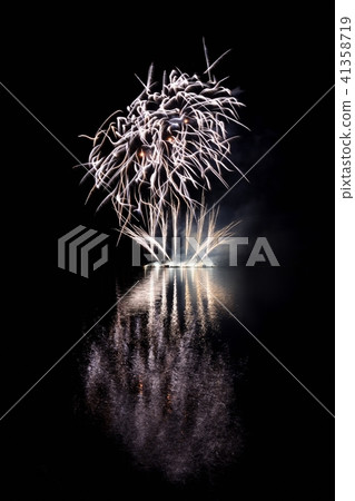 Beautiful colorful fireworks with reflections. 41358719