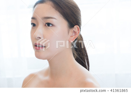 Woman sitting in the living room Woman sitting in the living room 41361865