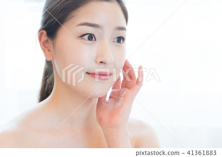 Woman sitting in the living room Woman sitting in the living room 41361883