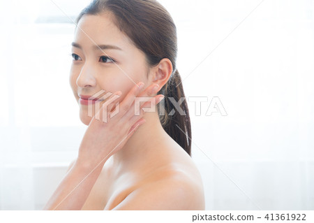 Woman sitting in the living room Woman sitting in the living room 41361922