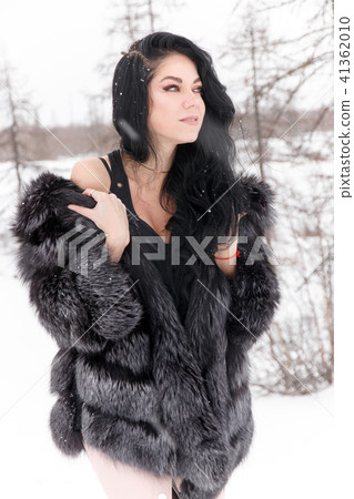 Woman in a winter forest Woman in a winter forest 41362010