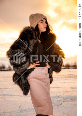 Girl at the background of a sunset 41362016