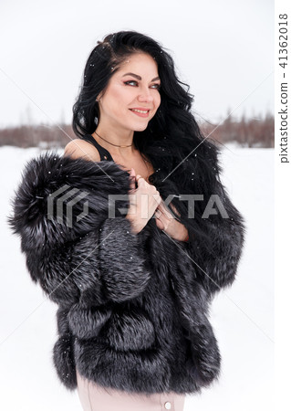 Woman in a winter forest Woman in a winter forest 41362018