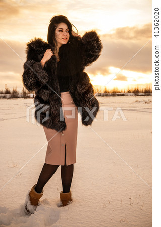 Woman in a winter forest Woman in a winter forest 41362020