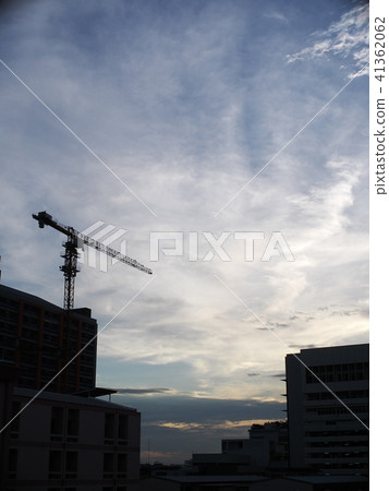 high crane lift on urban building silhouette 41362062