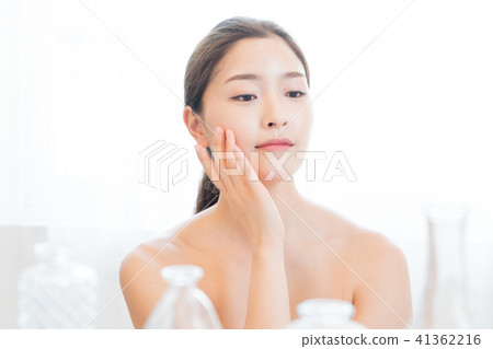 Woman sitting in the living room Woman sitting in the living room 41362216