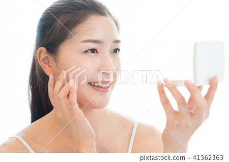 Woman sitting in the living room Woman sitting in the living room 41362363