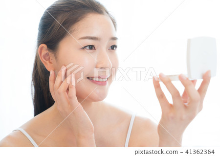 Woman sitting in the living room Woman sitting in the living room 41362364