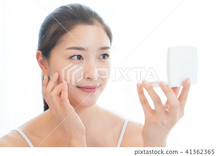 Woman sitting in the living room Woman sitting in the living room 41362365