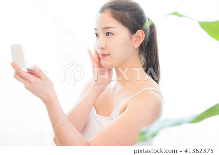 Woman sitting in the living room Woman sitting in the living room 41362375
