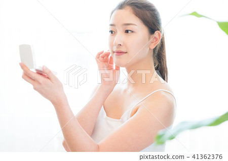 Woman sitting in the living room Woman sitting in the living room 41362376