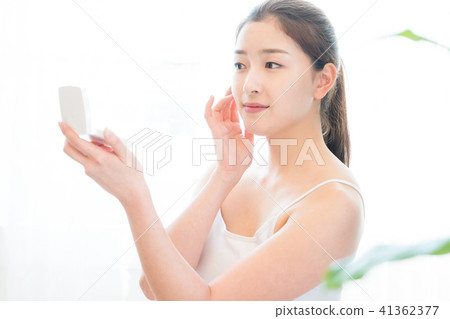 Woman sitting in the living room Woman sitting in the living room 41362377