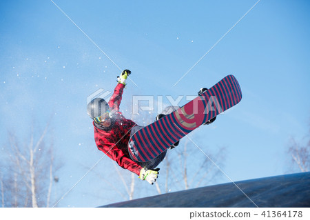 Picture of young athlete jumping with snowboard 41364178