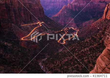 Road in Zion National Park with car light trails Road in Zion National Park with car light trails 41364711