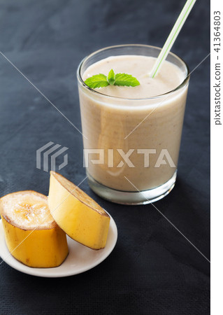 Banana smoothie with mint on dark background 41364803
