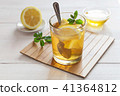 Glass of mint lemon tea and honey 41364812