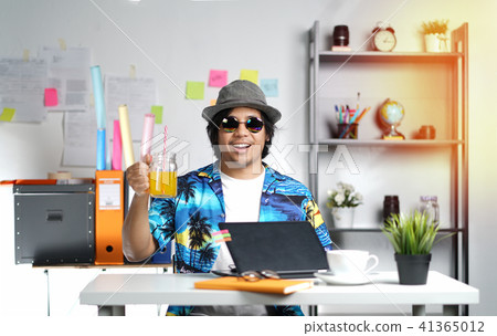 Stylish Young Man Holding Orange Juice Stylish Young Man Holding Orange Juice 41365012