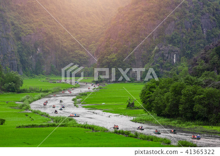Tourists traveling in boat, tamcoc, ninhbinh Tourists traveling in boat, tamcoc, ninhbinh 41365322