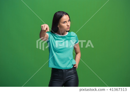 The overbearing business woman point you and want you, half length closeup portrait on green 41367313
