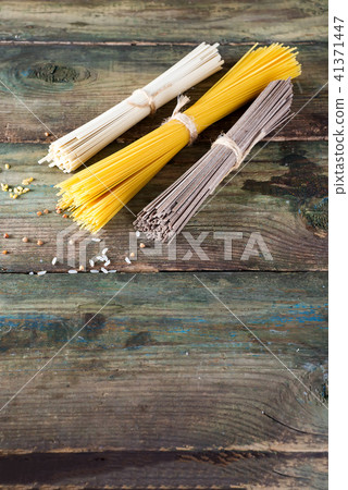 Noodles soba, somen and italian spaghetti on wooden background. Traditional Japanese food. Noodles soba, somen and italian spaghetti on wooden background. Traditional Japanese food. 41371447