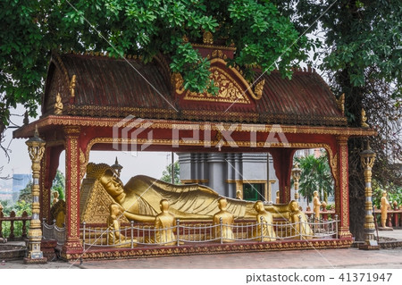 Reclining Buddha and monks wat kraom. cambodia Reclining Buddha and monks wat kraom. cambodia 41371947