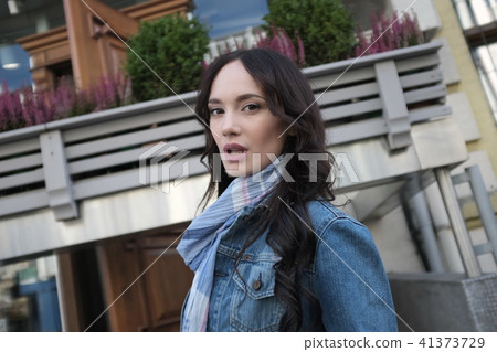 Beautiful young woman is walking 41373729