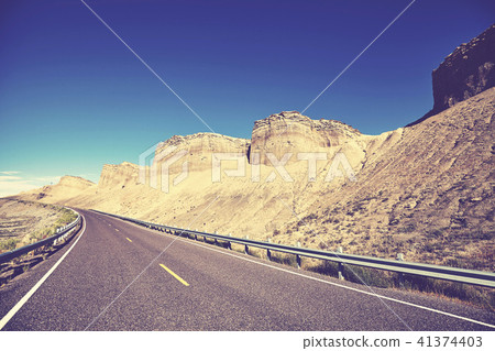 Vintage toned picture of a scenic road. 41374403