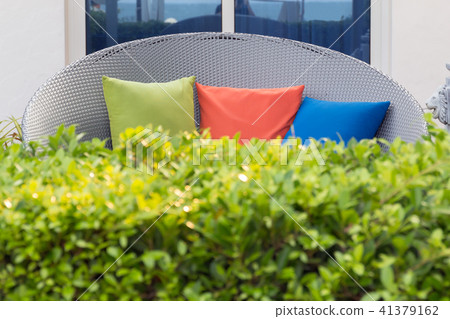 Modern sofa  wicker and color pillows. 41379162