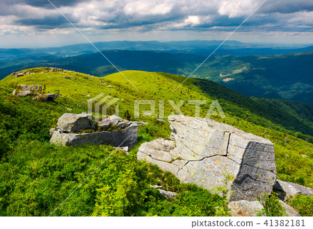 boulders on grassy hills 41382181