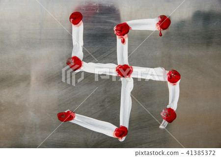 Swastik symbol on glass background Swastik symbol on glass background 41385372