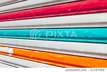 Artistic metal fence with colorful stripes Artistic metal fence with colorful stripes 41387569