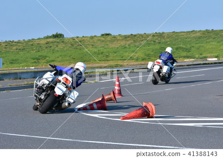 Police motorcycle officers honing their driving skills Police motorcycle officers honing their driving skills 41388143